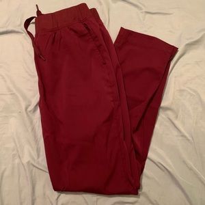 ADAR women’s scrub pants. Dark red in color